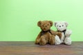 Teddy bear on old wood ,green wall background Royalty Free Stock Photo