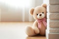 A teddy bear peek around the corner of the wall. Space for text. Royalty Free Stock Photo