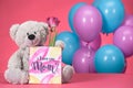 teddy bear with pink tulip and postcard with text I Love You Mom, mothers Royalty Free Stock Photo