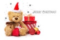 Teddy bear in a red cap and boxes with gifts on a background with stars Royalty Free Stock Photo