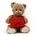 Teddy bear with red gift box, present with ribbon bow, isolated on white background Royalty Free Stock Photo