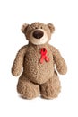 Teddy bear with red ribbon aids awareness Royalty Free Stock Photo