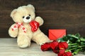 Teddy bear, red roses and red envelope Royalty Free Stock Photo