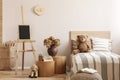 Teddy bear on single wooden bed in natural kid`s bedroom Royalty Free Stock Photo