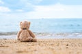 Teddy bear sit alone at the seashore Royalty Free Stock Photo