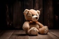 Teddy bear sitting on a floor and on green grass on wodden and nature background Royalty Free Stock Photo