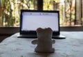 Teddy bear sitting in front of laptop computer device. Still Life. Child using digital technology. Conceptual background concept. Royalty Free Stock Photo