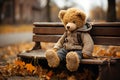 Teddy bear sitting on a park bench, forgotten lonely child toy with wet fur, rainy day in autumn