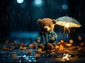 Teddy bear sitting in the raining with the umbrella