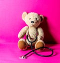 Teddy bear with stethoscope for checking an injury after mishap Royalty Free Stock Photo