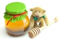 Teddy bear ,stick to hohey and jar of honey
