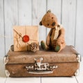 Teddy bear on a suitcase with love messages Royalty Free Stock Photo