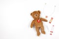 Teddy bear with toy stethoscope and toy medicine tools on a white background. Top view. Copy space for text Royalty Free Stock Photo