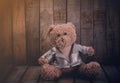 Teddy bear on wooden background - still lift.