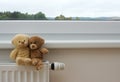 Teddy bears on the heater Royalty Free Stock Photo