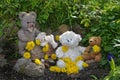 Teddy bears with many dandelion flowers