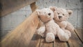 Teddybears sitting on a bench in the park Royalty Free Stock Photo