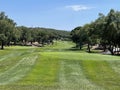 Tee shot of long golf hole with beautiful green grass Royalty Free Stock Photo