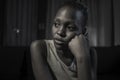 Teen African American girl at night suffering depression - dramatic artistic portrait of young attractive sad and depressed black Royalty Free Stock Photo