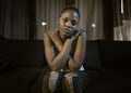 Teen afro American girl at night suffering depression - young attractive sad and depressed black woman lying thoughtful feeling Royalty Free Stock Photo