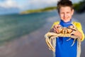 Teen age boy holding crab Royalty Free Stock Photo