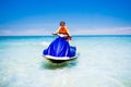 Teenager on water scooter. Teen age boy water skiing. Royalty Free Stock Photo