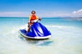 Teenager on water scooter. Teen age boy water skiing. Royalty Free Stock Photo