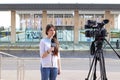 Teen age girl reporter talking in front of knesst Royalty Free Stock Photo