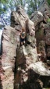 Teen Boy on Large Rock at Devil`s Lake State Park in Wisconsin Royalty Free Stock Photo