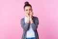 Teen anxiety. Portrait of worried brunette girl biting nails with panicked terrified face. indoor studio shot Royalty Free Stock Photo