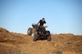 Teen on ATV quad in the hills Royalty Free Stock Photo