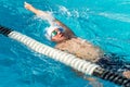 Teen backstroke swimmer in action. Royalty Free Stock Photo