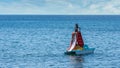 Teen in bathing suit sitting on paddleboat with slide