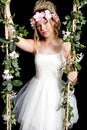 Teen Blonde Girl - Close-up on Swing - Flowers Royalty Free Stock Photo