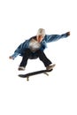 Teen boy, active guy in casual clothes in motion, training, practicing stunts on skateboard isolated over white Royalty Free Stock Photo