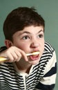 Teen boy brushing his teath Royalty Free Stock Photo