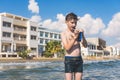 Teen boy after dives in the wave of sea on the tropical resorts. Concept of summer Royalty Free Stock Photo