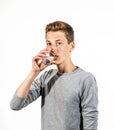 Teen boy drinks water Royalty Free Stock Photo