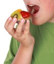 Teen boy eating tartlet