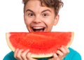 Teen boy eating watermelon