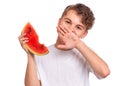 Teen boy eating watermelon