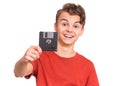 Teen boy with floppy disk Royalty Free Stock Photo