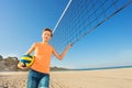 Teen boy getting ready for beach volleyball game Royalty Free Stock Photo