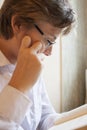 Teen boy in glasses reads a book Royalty Free Stock Photo