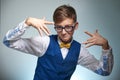 Boy teenager with braces in glasses. Wearing a shirt with a bow tie. Royalty Free Stock Photo