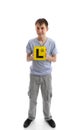 Teen boy holding L learner plates Royalty Free Stock Photo