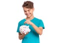 Teen boy holding piggy bank Royalty Free Stock Photo