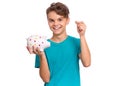 Teen boy holding piggy bank Royalty Free Stock Photo