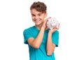 Teen boy holding piggy bank Royalty Free Stock Photo