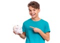 Teen boy holding piggy bank Royalty Free Stock Photo